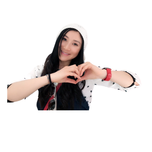 An Asian female smiling with hands making a heart